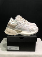 Side view of the bone white AMIRI MA Runner sneakers with layered panels, mesh sections and sculpted soles.