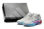 Light gray Adidas Adizero shoes and a dark shoebox