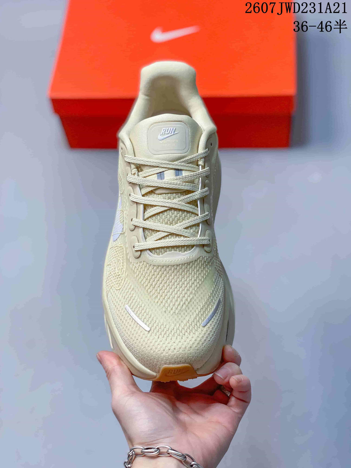 Top view of one cream sneaker showing the lace-up closure, textured toe box, and tongue label.