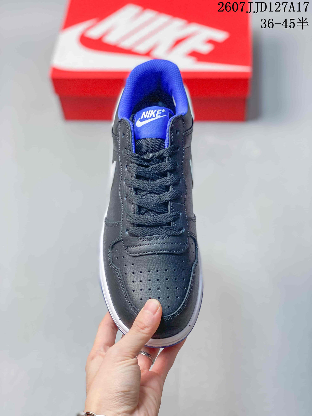 Top view of the sneaker showing black laces, blue tongue lining, and perforations on the toe box.