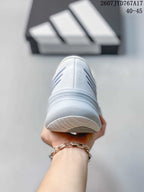 Rear view of the white sneaker showing the heel construction and outsole edge.