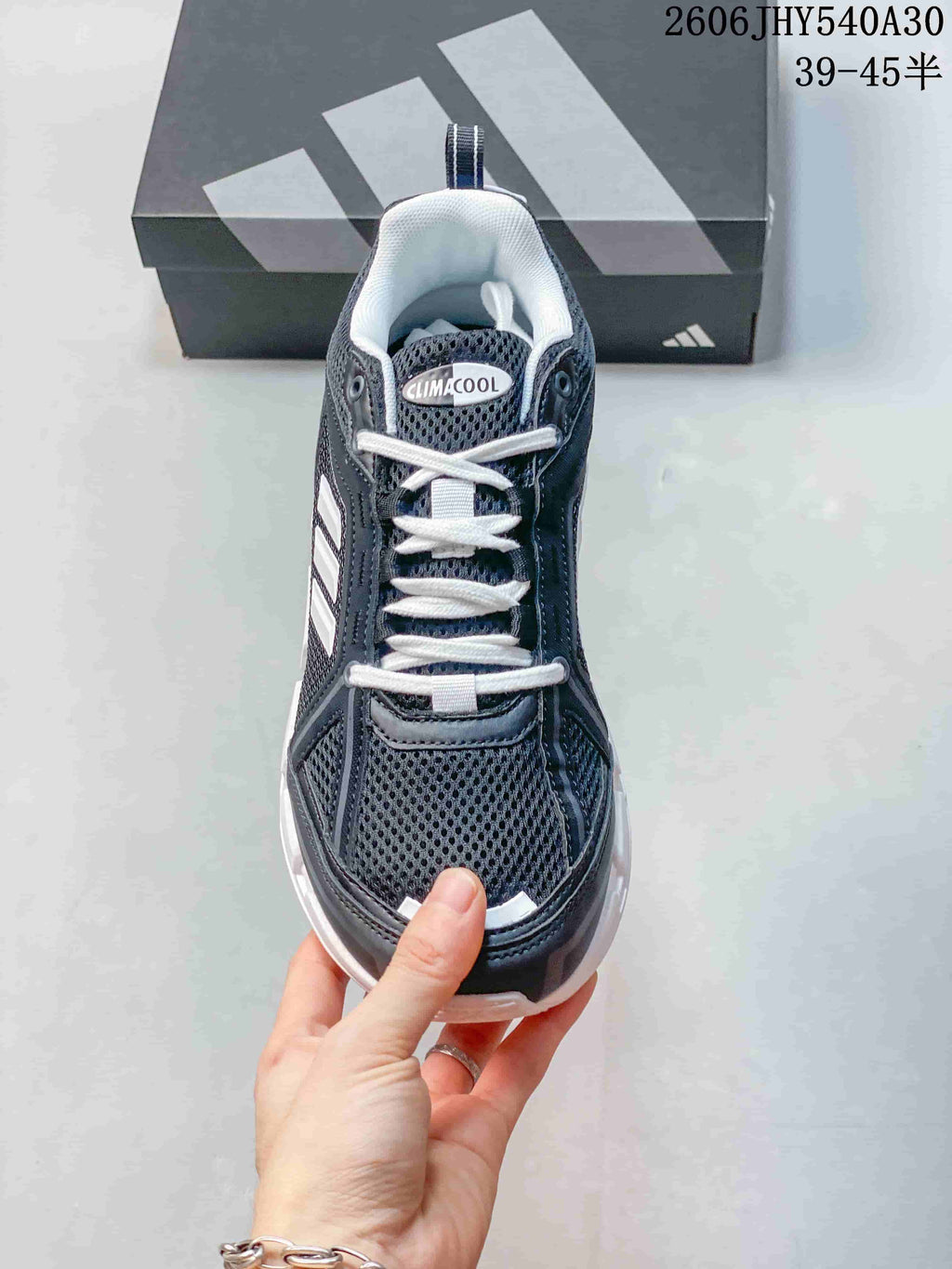 Front view showing the mesh toe, white laces, and Climacool tongue label.
