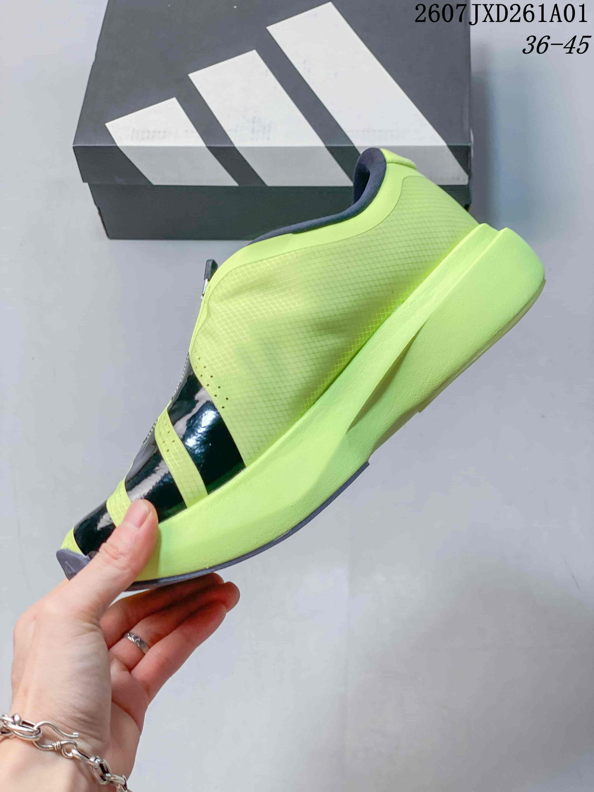 Side view of the volt yellow shoe with dark stripes and sculpted sole