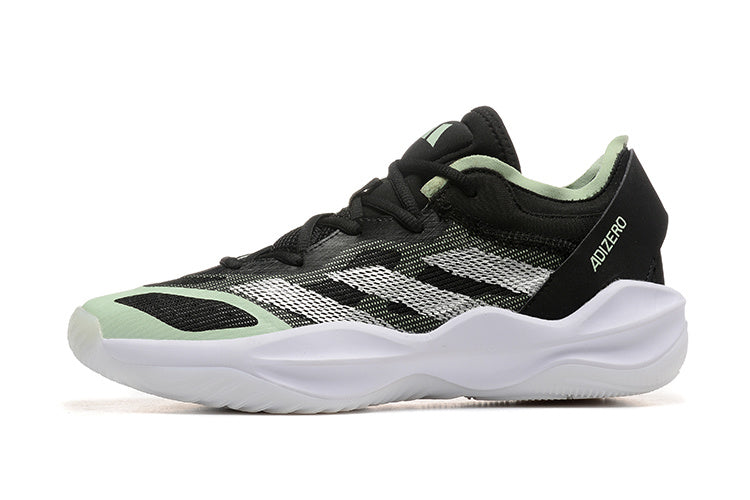 Side view of a black Adidas Adizero shoe with white stripes and mint accents