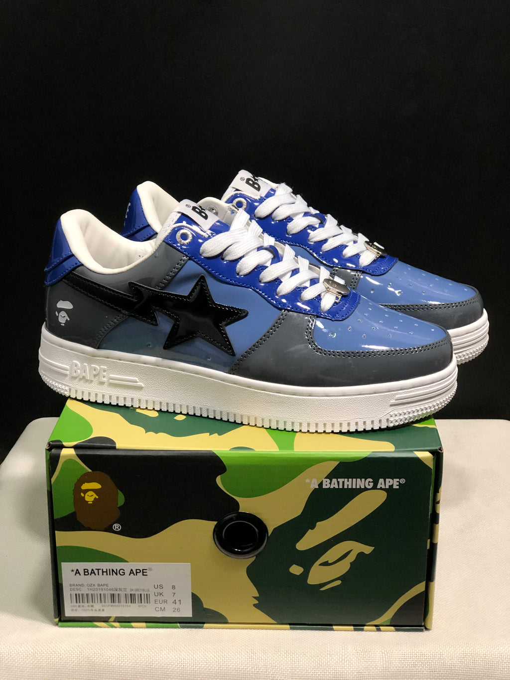 Pair of blue and gray Bape Sta sneakers displayed on a branded shoebox, with the box label showing EU 41.