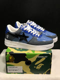 Pair of blue and gray Bape Sta sneakers displayed on a branded shoebox, with the box label showing EU 41.