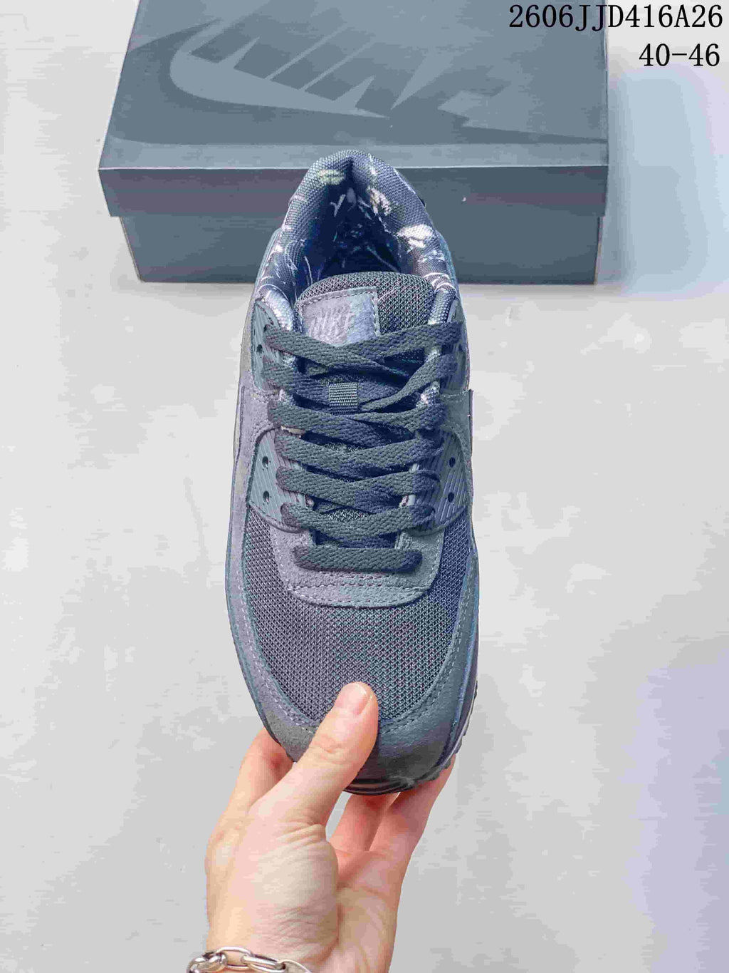 Top view of the gray sneaker showing the mesh toe box, laces, and padded tongue.