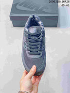 Top view of the gray sneaker showing the mesh toe box, laces, and padded tongue.