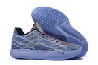 Side and outsole view showing patterned tread on the light-blue sole