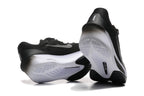 Black Nike Zoom Fly 6 shoes showing white and black outsole details