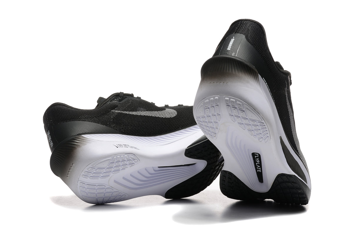 Black Nike Zoom Fly 6 shoes showing white and black outsole details