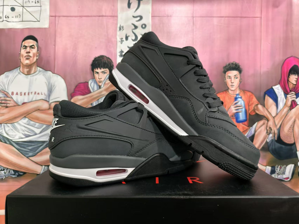 Pair of black Nike basketball sneakers shown from the side, with white midsole accents and red details.