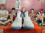 Front view of white Nike Hyperdunk high-top shoes with yellow and purple accents.