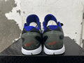 Rear view of gray camouflage basketball shoes with blue collars and dark heel details