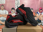 Black and red Nike Shox sneakers shown from the side