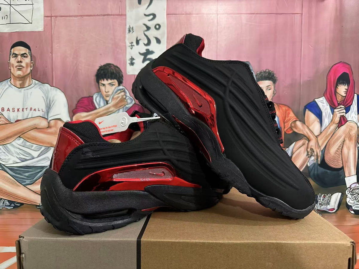 Black and red Nike Shox sneakers shown from the side