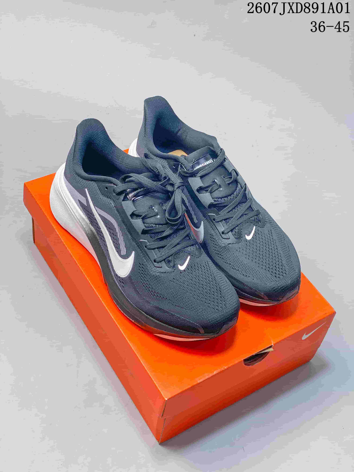 Dark gray Nike Air Zoom Pegasus 42 running shoes displayed on an orange shoe box.