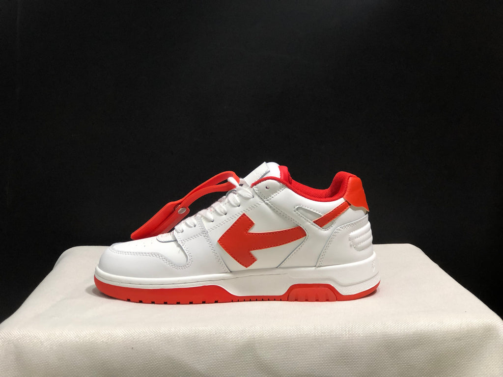 Lateral profile showing the white upper, red arrow detail, padded heel, and red outsole.