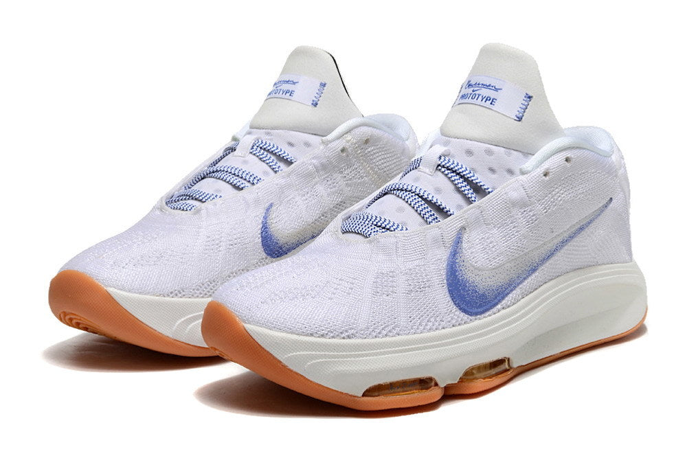 Pair of white Nike GT Hustle 3 basketball shoes with blue accents and gum-colored outsoles.
