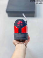 Rear view of the sneaker showing the red glossy heel, black heel tab, padded collar, and black outsole.