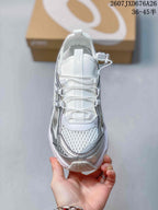 Top view of the sneaker showing the mesh-look toe panel, lace system, tongue pull tab, and contrasting silver overlays.
