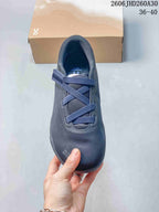 Top view of a dark navy On Cloudnova Moon sneaker with crossed straps and a hook-and-loop fastening.
