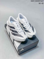 Pair of white and black adidas Adizero Evo SL 2 running shoes displayed on an adidas shoe box.