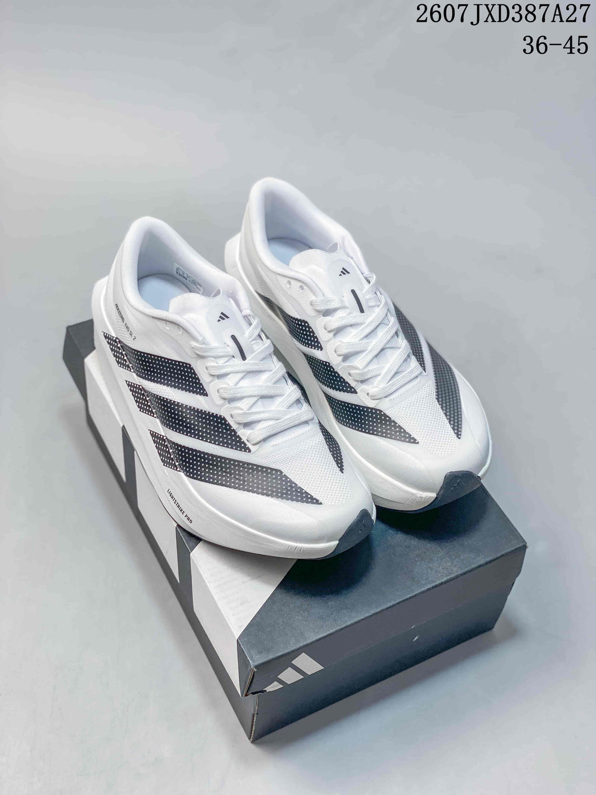 Pair of white and black adidas Adizero Evo SL 2 running shoes displayed on an adidas shoe box.