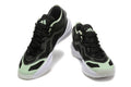 Pair of black Adidas Adizero shoes with mint accents, shown from the front