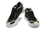 Pair of black Adidas Adizero shoes with mint accents, shown from the front