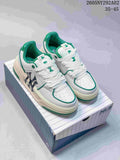 Pair of white MLB Chunky Liner sneakers with green accents on a box