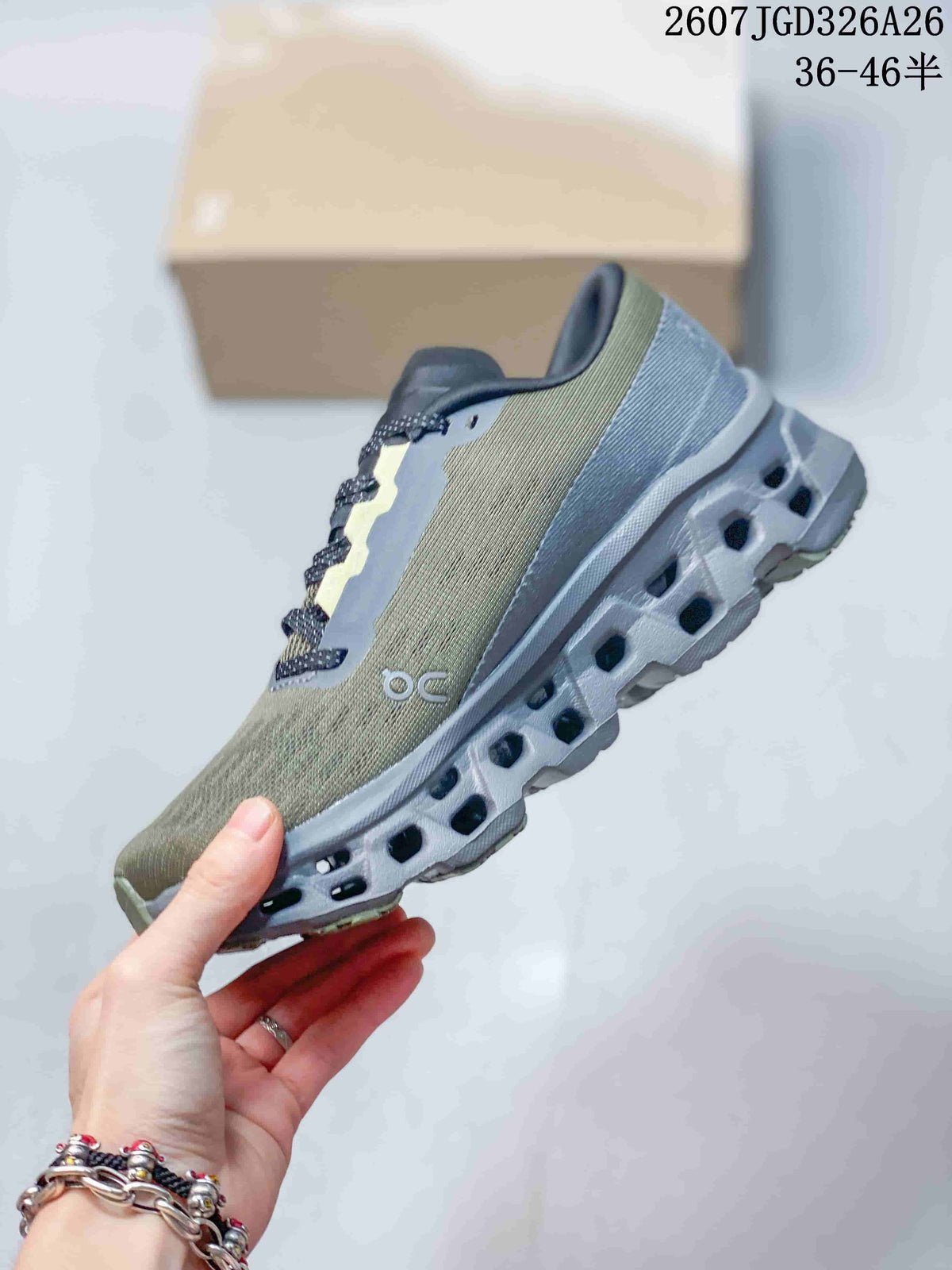 Side profile of the olive and gray sneaker showing the lace-up upper, side branding, and open-channel outsole.