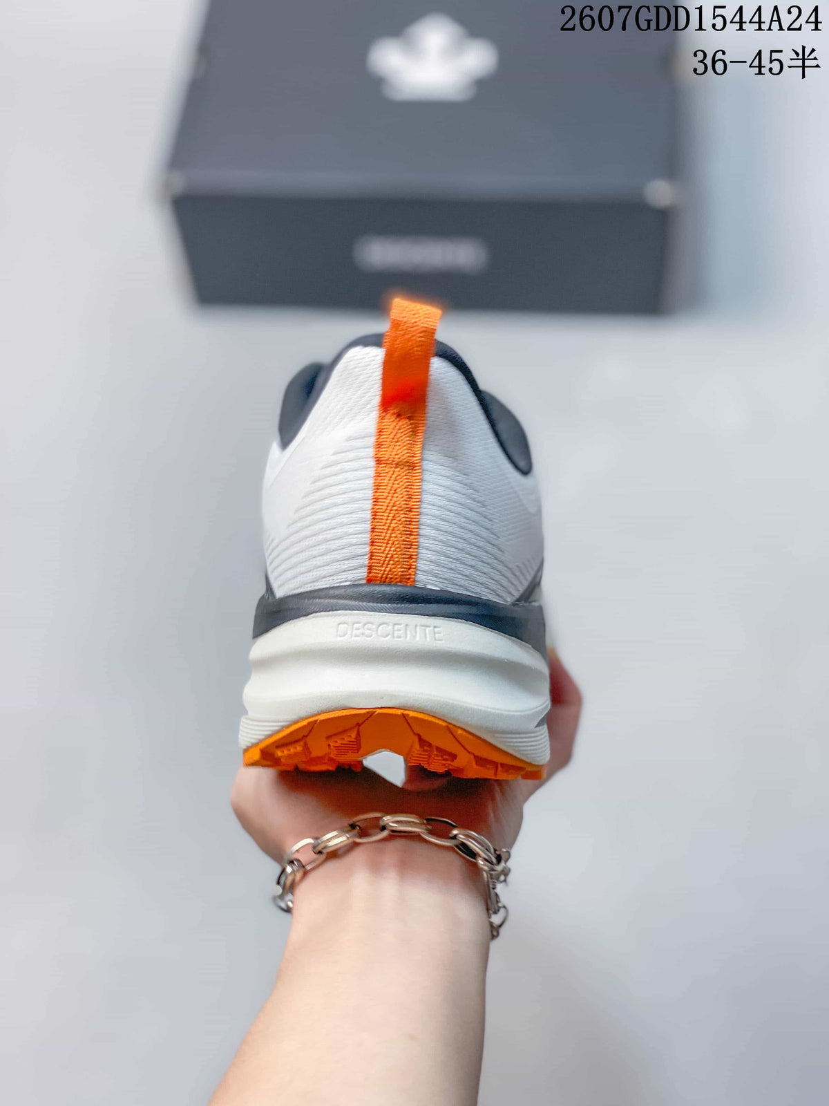 Rear view showing the white heel, orange pull tab, black heel detail, and orange outsole.