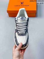 Front view showing perforated toe, patterned trim, and contrast laces