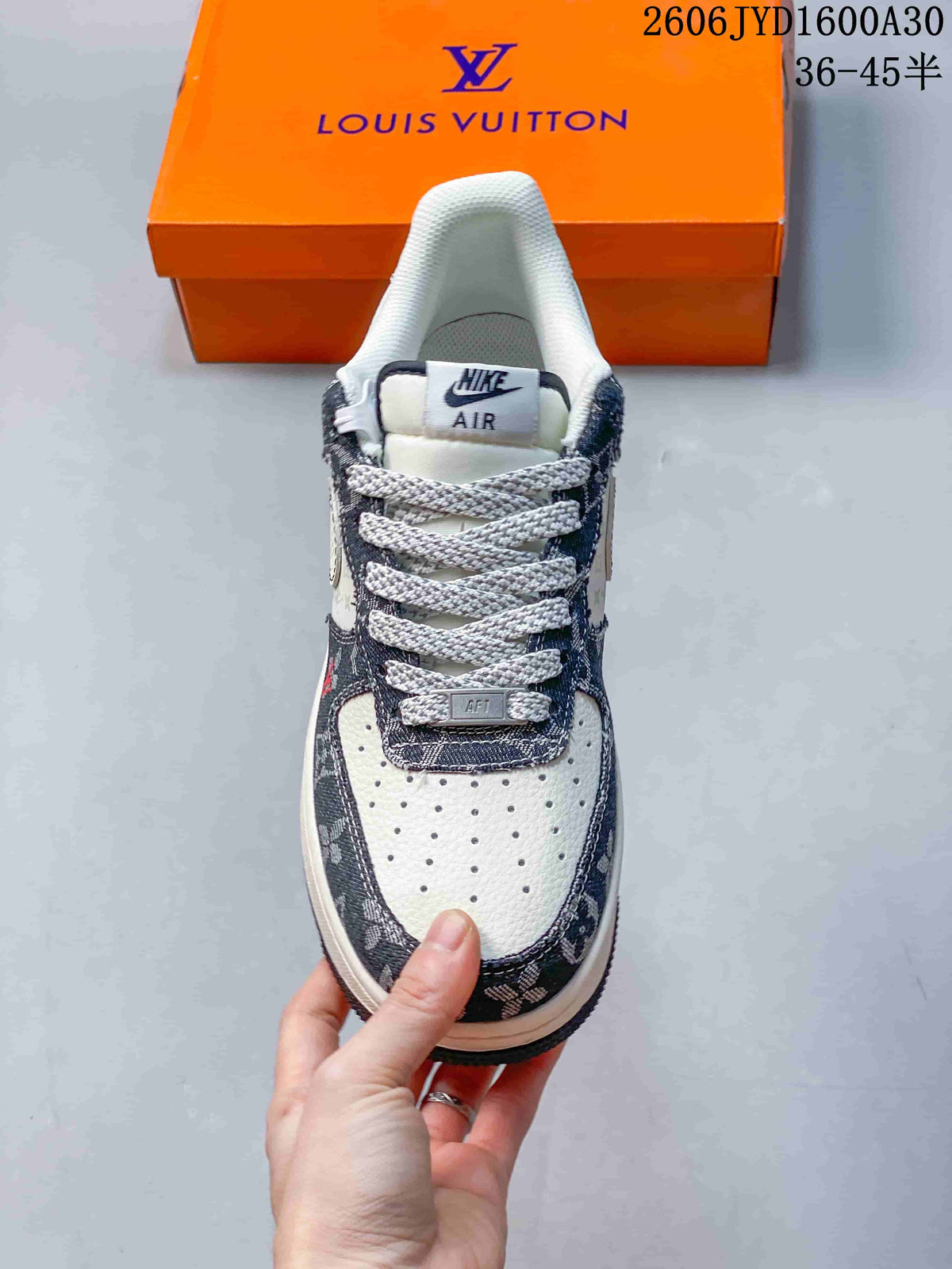 Front view showing perforated toe, patterned trim, and contrast laces