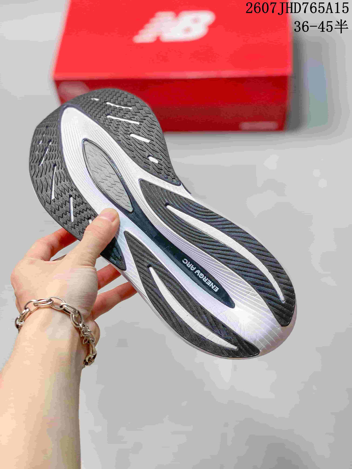 Outsole view showing the black and white segmented traction pattern and FuelCell branding.