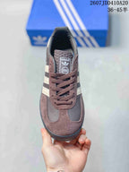 Top view showing the brown laces, branded tongue, contrasting panels, and rounded toe.