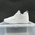 White low-top basketball shoe with a tonal sculpted sole
