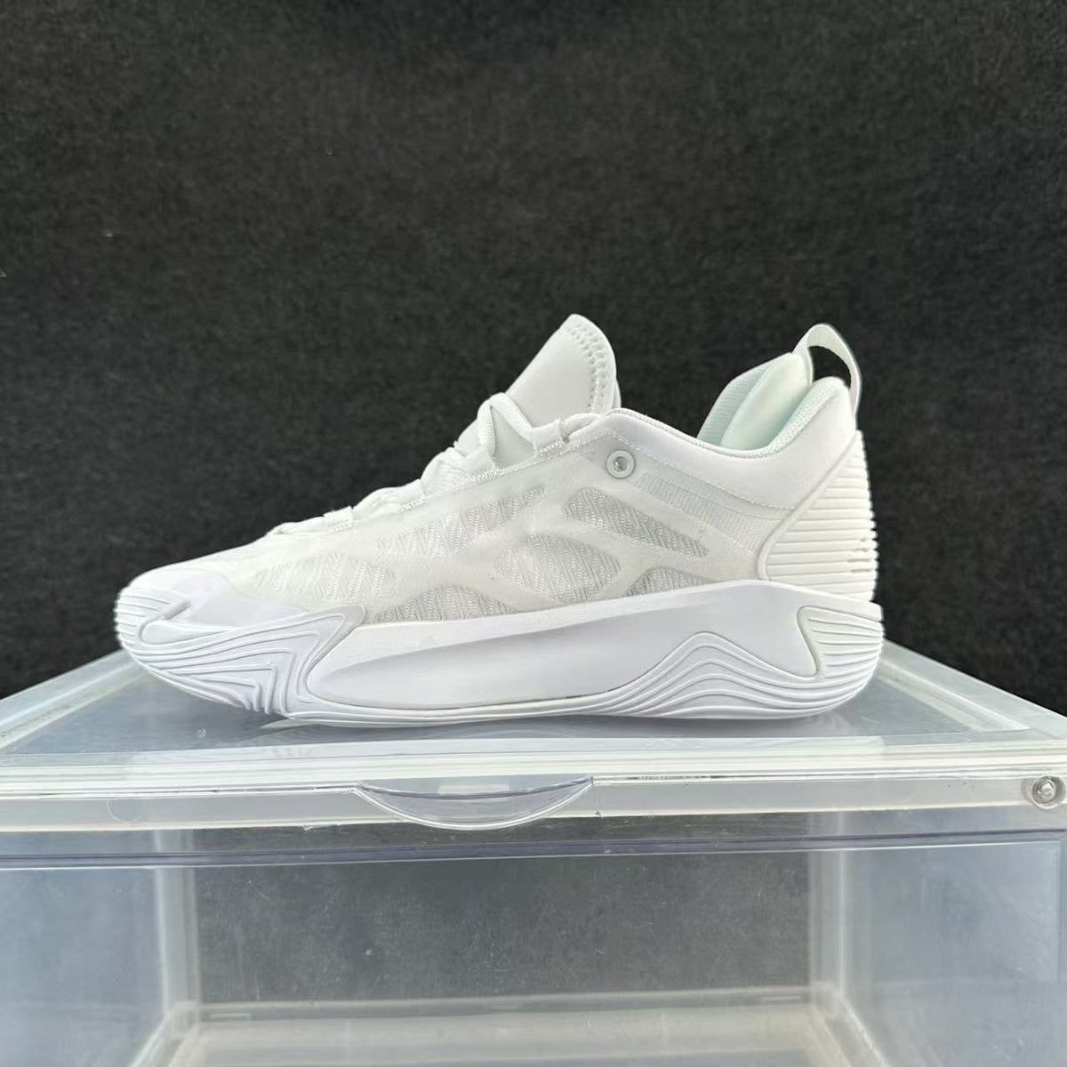 White low-top basketball shoe with a tonal sculpted sole