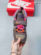 Top view showing patterned toe panels, pink and orange laces, and two wide forefoot straps with Nike swoosh details; image text shows 2607JVD416A16 and 40–45.