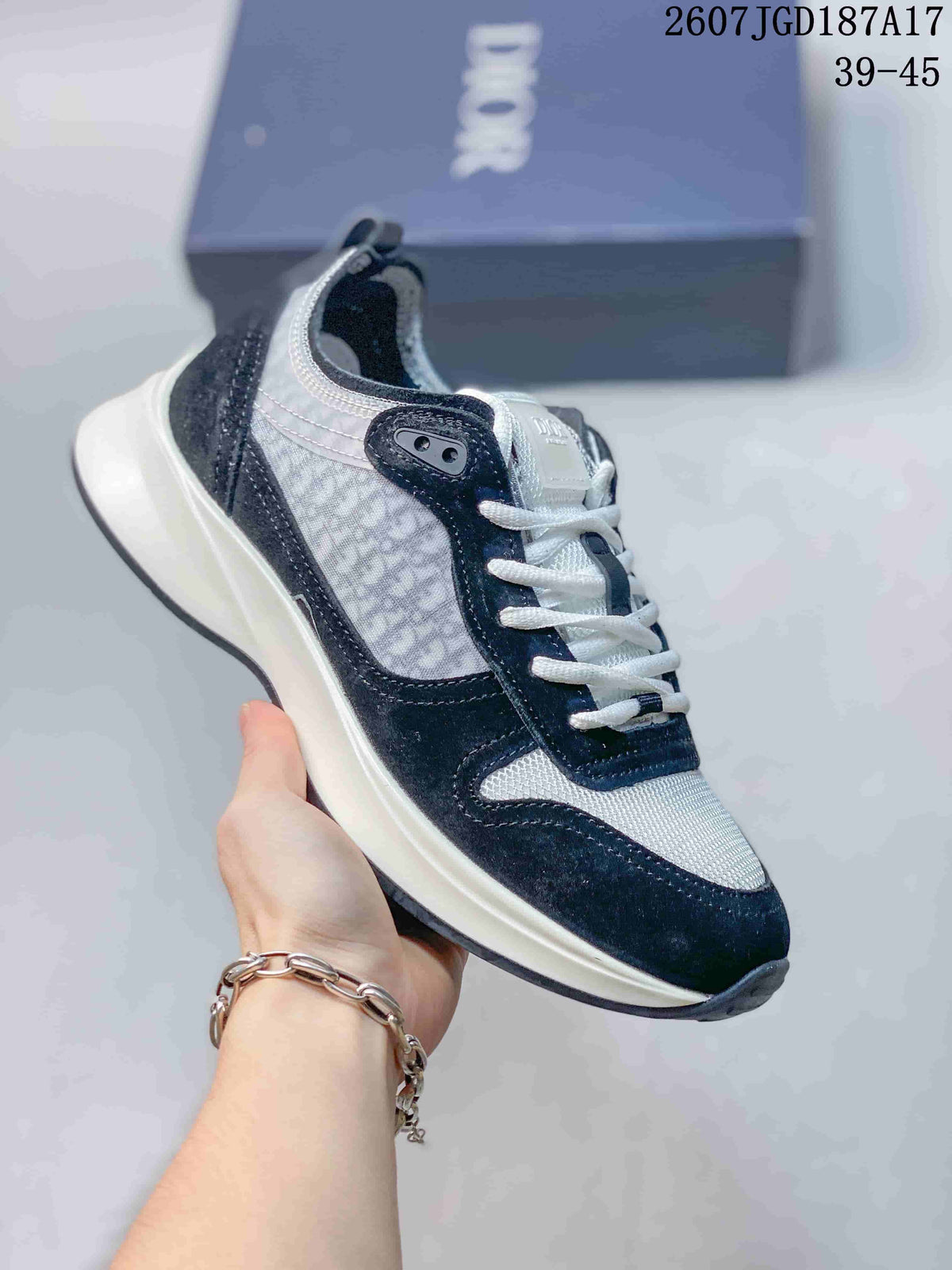 Black and white Dior B25 Runner sneaker with textured side panels and a light outsole.