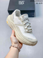 Angled view of the ivory low-top hiking shoe