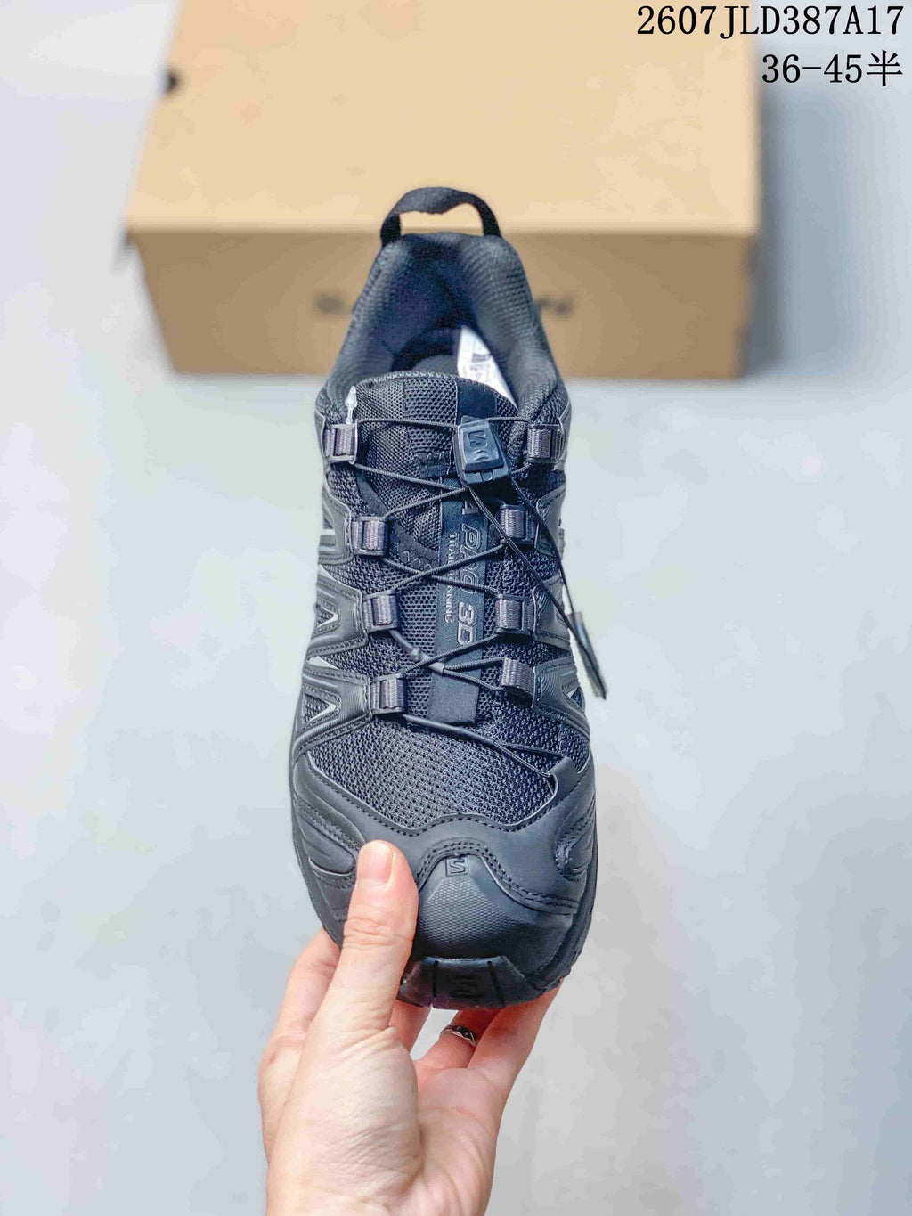 Top view of the black Salomon XA PRO 3D shoe showing the mesh toe area, layered overlays, and lace-and-toggle closure.