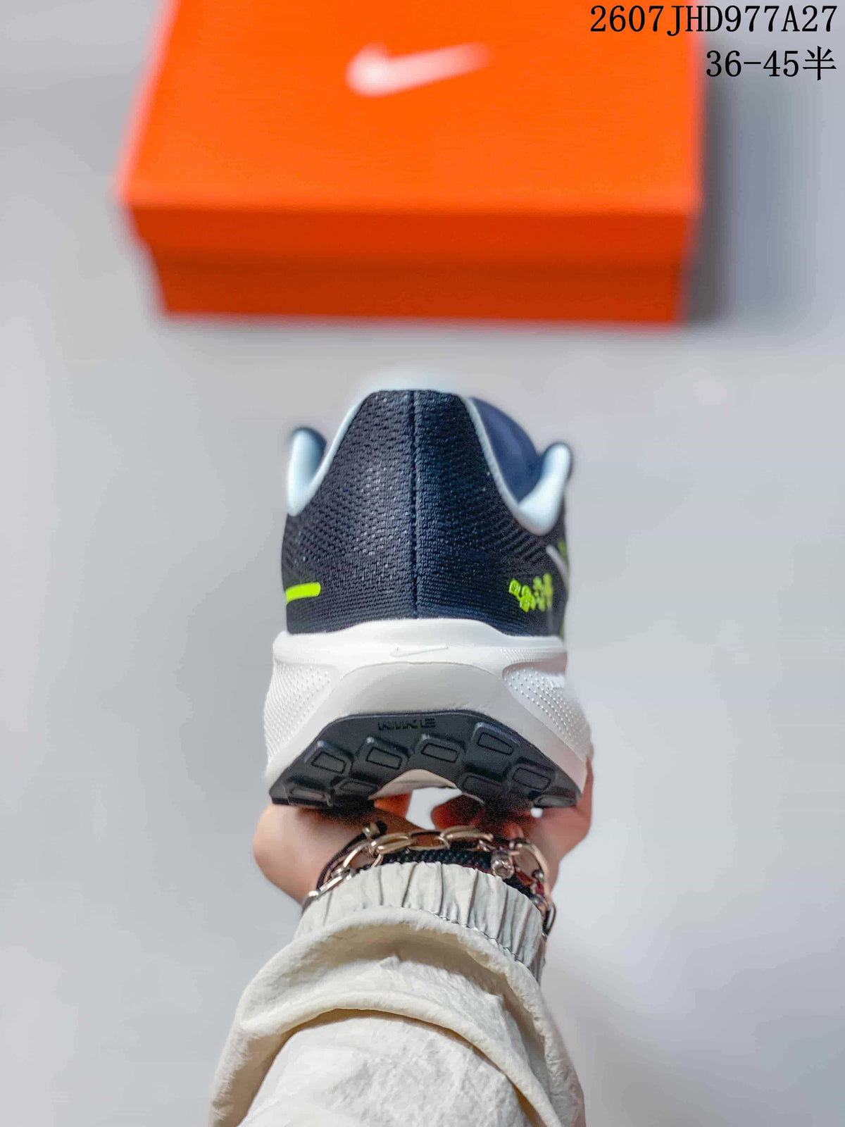 Rear view of a navy running sneaker showing the padded heel, white midsole, and dark outsole.