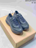 Pair of black Salomon-style low-top sneakers displayed on a tan box, with the listed range 35–40 visible above.