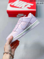 Side profile showing the lilac Swoosh overlay, low-top construction, and light outsole.