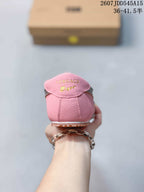 Rear view of the pink sneaker showing the branded heel tab and textured outsole.