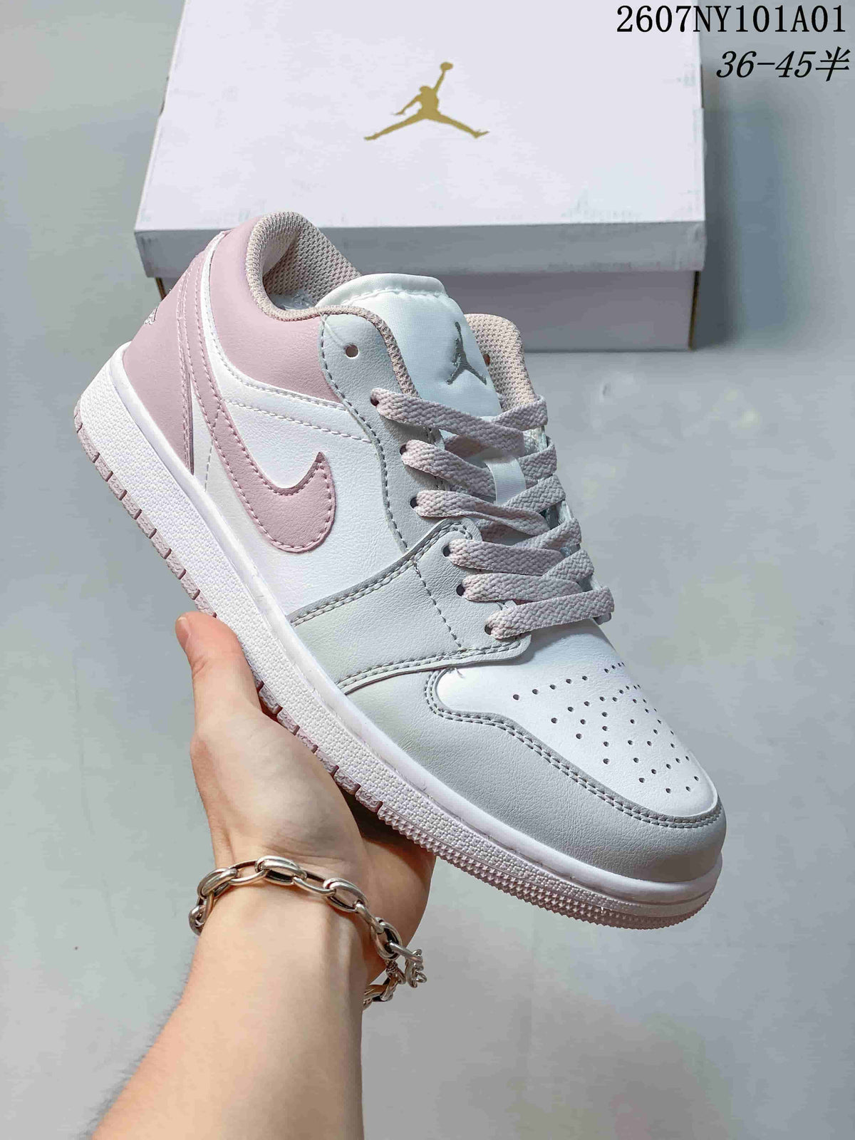 Angled side view highlighting the pale pink Swoosh and heel accents.