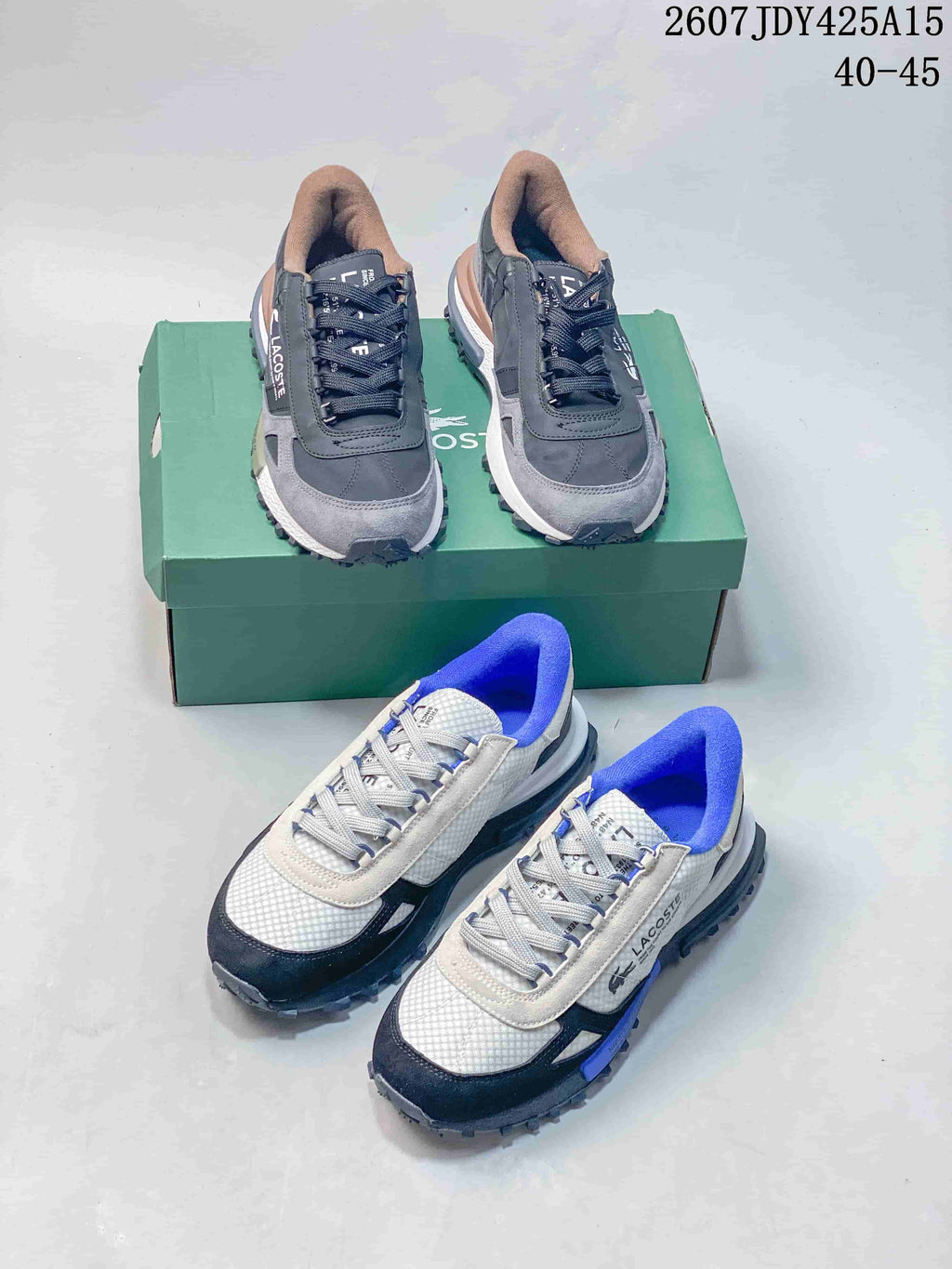 Both visible Lacoste colorways arranged together, including black and gray and white, navy and blue sneakers.