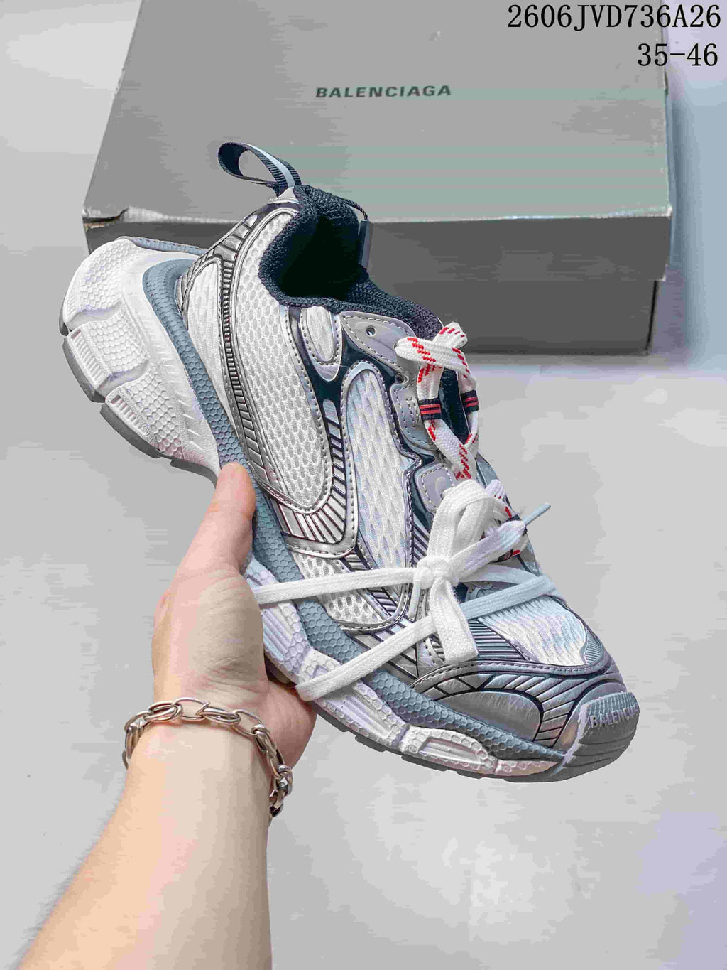White Balenciaga 3XL-style sneaker with silver and dark accents